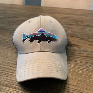 Patagonia hat and Green Bay packer Reebok fly bill